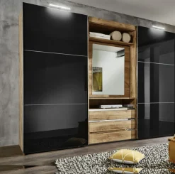 Armoire à portes coulissantes avec miroir pivotant intégré MAGIC GLAS